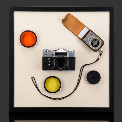 купить Настенная композиция, оформленная в современную раму "Фотоаппарат Zenit-E и оборудование для фото", металл, пластик, дерево, текстиль, СССР, 1970-1990 гг.