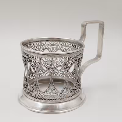 купить Подстаканник с ажурным декором, мельхиор (медь-никель), скань, Артель «Мстерский ювелир» им. В. М. Молотова, СССР, 1949-1952 гг.