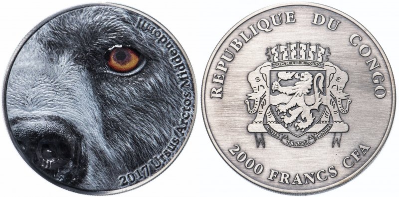 Монета с изображением глаза медведя кадьяка