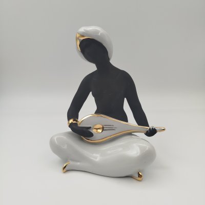 купить Статуэтка "Шахерезада", скульптор Богданова О.М., фарфор, крытьё, золочение, Дулевский фарфоровый завод (Дулёво), Российская Федерация, 2002 г.