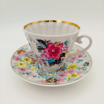 купить Чайная пара в подборе (блюдце "Ситец", чашка "Март"), форма "Лучистая", автор формы Н.П. Славина, фарфор, деколь, золочение, Ленинградский фарфоровый завод (ЛФЗ), СССР, 1970-1986 гг.