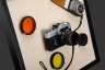 Купить Настенная композиция, оформленная в современную раму "Фотоаппарат Zenit-E и оборудование для фото", металл, пластик, дерево, текстиль, СССР, 1970-1990 гг.