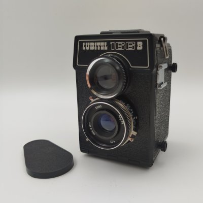 купить Фотоаппарат "Любитель-166" в кофре, металл, стекло, бакелит, ЛОМО (Ленинградское оптико-механическое объединение), СССР, 1976-1996 гг.