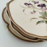 Купить Набор десертных тарелок в стиле модерн, выполненных в форме листьев с изображением полевых цветов, (3 шт.), фарфор, роспись, золочение, Западная Европа, 1910-1930 гг.