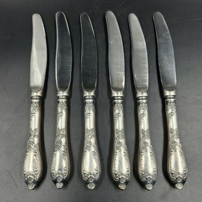 купить Набор из шести десертных ножей с растительным декором, мНЦ (медь-никель-цинк), сталь, Вольнянский завод столовых приборов им. Шевченко (ЗiШ, ЗиШ), СССР, 1960-1980 гг.