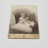Купить Фотография с изображением ребенка, фотоателье "Леон и Ко", г. Санкт-Петербург, бумага, фотопечать, картон, Российская империя, 1900-1917 гг.