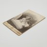 Купить Фотография с изображением ребенка, фотоателье "Леон и Ко", г. Санкт-Петербург, бумага, фотопечать, картон, Российская империя, 1900-1917 гг.