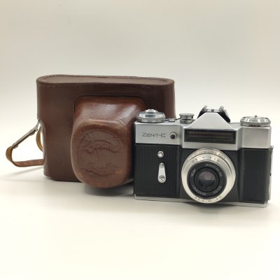 купить Фотоаппарат "Зенит-Е" с объективом "Индустар-50"в оригинальном кофре, металл, стекло, пластик, кожа, Красногорский механический завод (КМЗ), СССР, 1965-1986 гг.