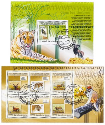 купить Гвинея набор марок из 2 квартблоков "Флора и фауна. Млекопитающие. Тигры и горные козлы"