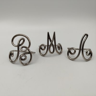 купить Набор из 3 колец для салфеток с буквами "Л", "М" и "В", металл, серебрение, Россия, 1890-1930 гг.