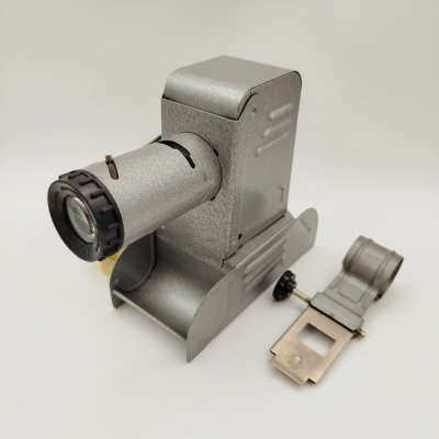 купить Фильмоскоп в коробке, с набором диафильмов, Завод "Электрооборудование", металл, стекло, пластик, картон, СССР, 1960-1970 гг.